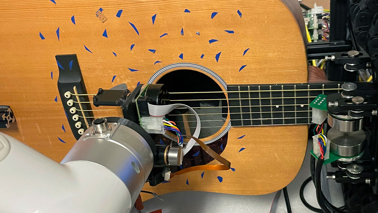 GTCMT's guitar bot plays a guitar